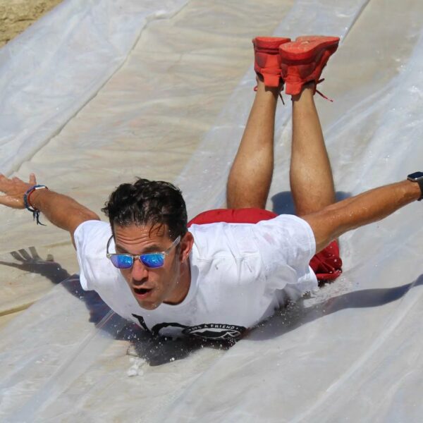 teen sliding down slip n slide