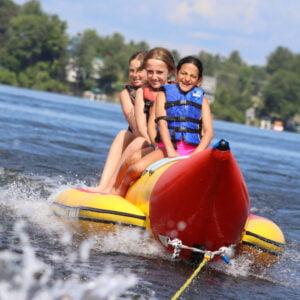 3 girls enjoying banana boat activity