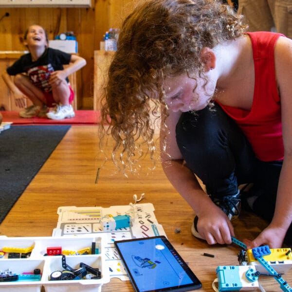 Camper building a robot