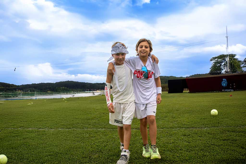 Two boys arm and arm