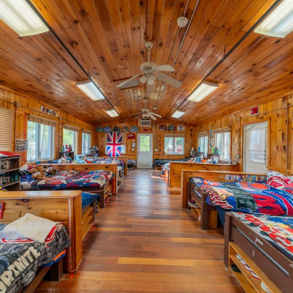 Boys cabin with nicely made beds