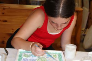 Camper working on an art project