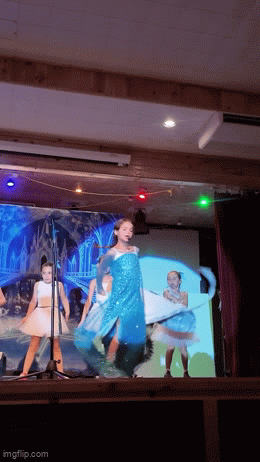 Girl dressed up as Elsa from Frozen performing in Camp Pontiac's theater
